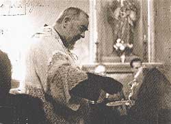 Padre Pio gives communion to Mary